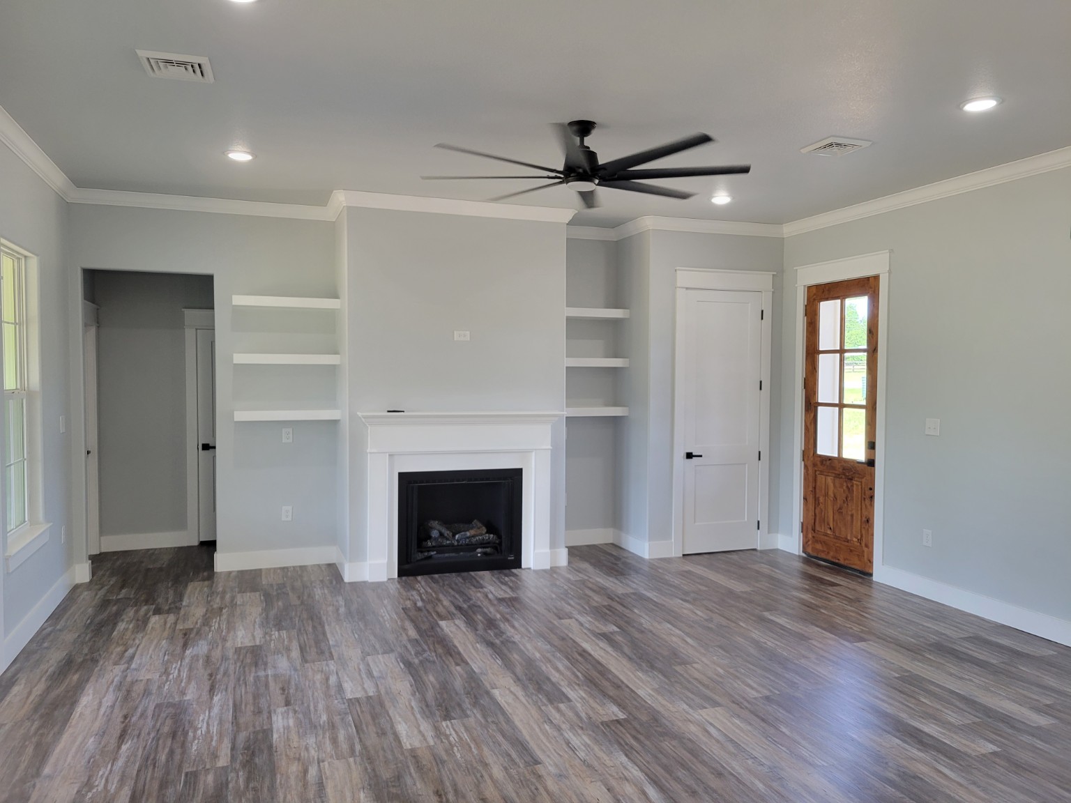 Completed living room with fireplace and built-ins