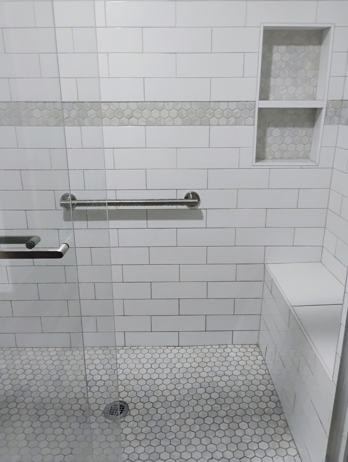 Accessible tile shower with built-in niches